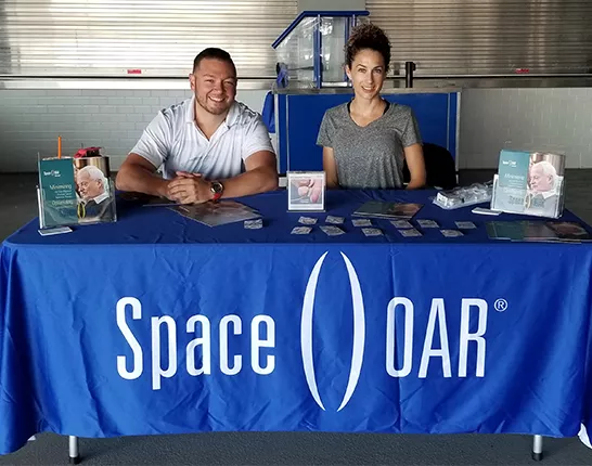 Two SpaceOar representatives tabling at an event