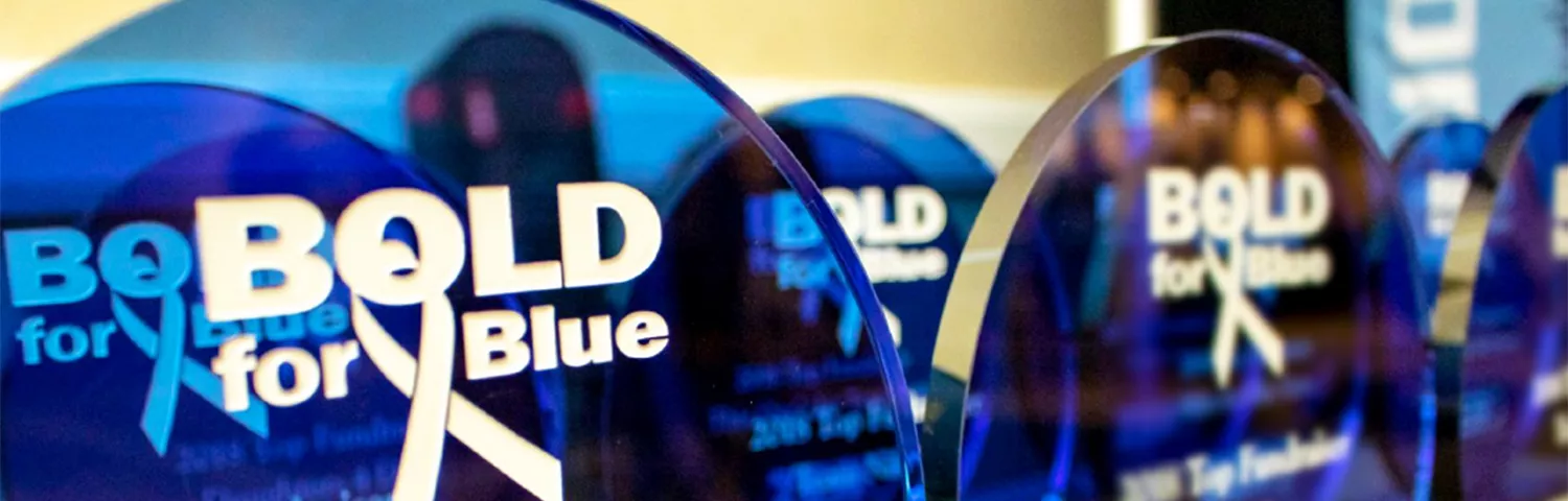 Close up of several Bold for Blue awards on a table