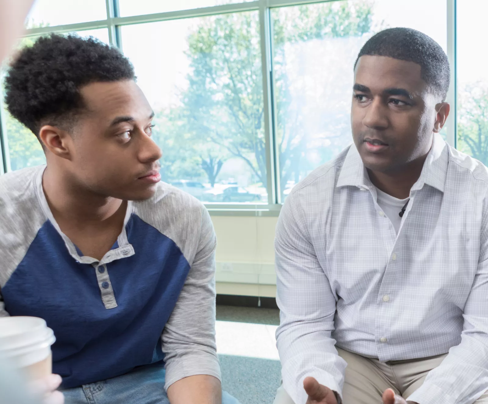 Two Men Sitting 