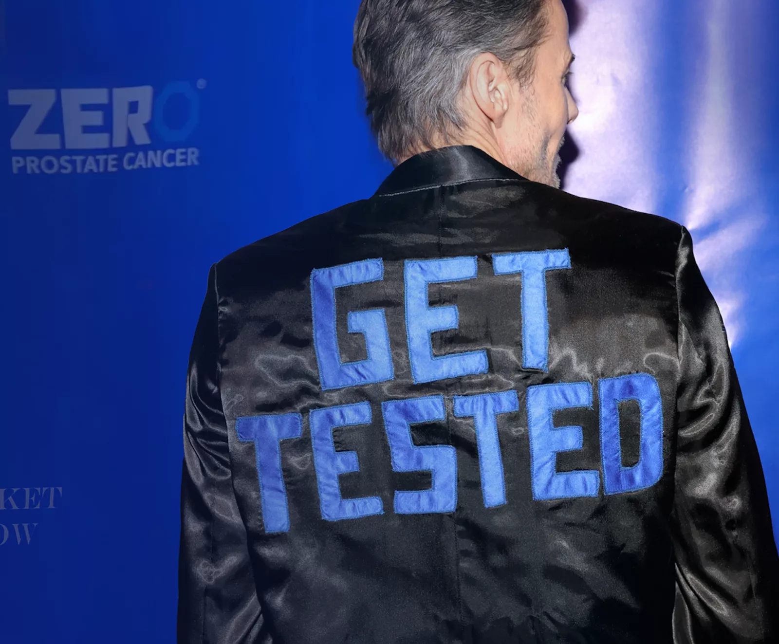 Fashion Show man with Get Tested Jacket on
