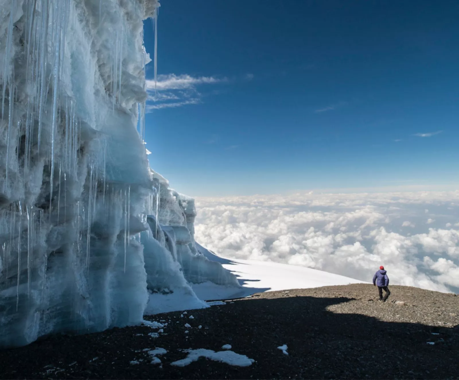 Icy mountain side with hiker