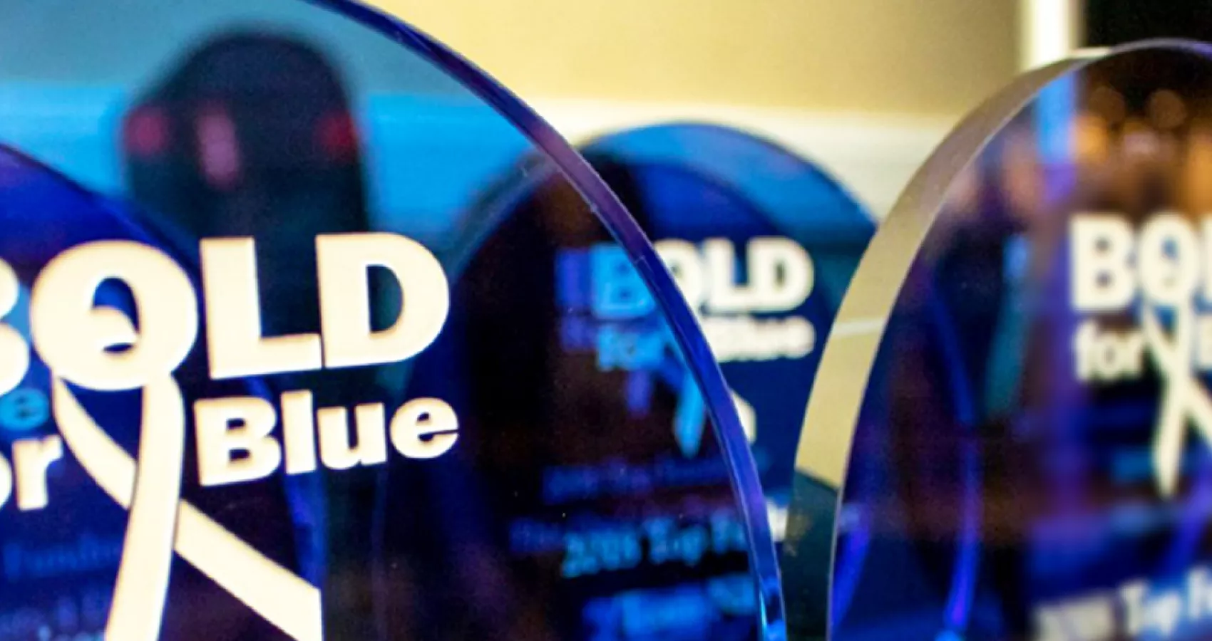 Close up of several Bold for Blue awards on a table