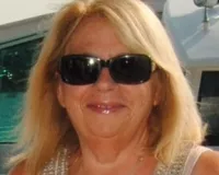 Woman with blond hair and dark sunglasses, Cheryl Nikituk