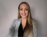 Young woman with blond hair in a grey suit, Jessica Fetrow