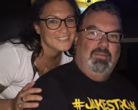 Caucasian couple posing at a sports bar