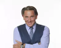 Caucasian man in a dark blue suit