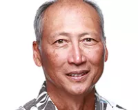 Men of Asian descent wearing a colorful shirt