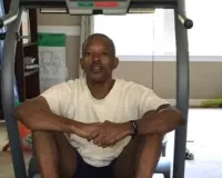 African American men posing in front of a pile of food supplements