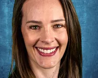 Headshot of a young woman with brown hair