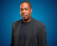 Picture of Senior writer at Andscape, Jerry Bembry wearing a black suit