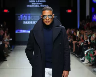 Don Lemon walking the runway at a Blue Jacket Fashion Show