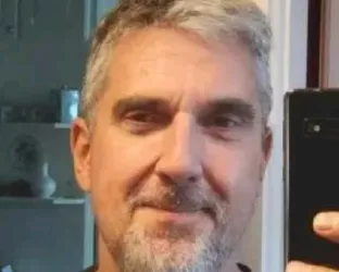 A white man taking a selfie