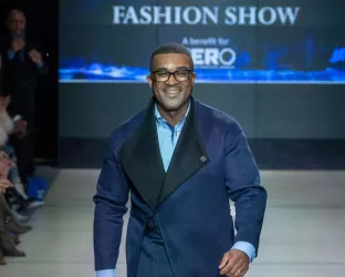 J&J Oncology President, Tyrone Brewer, walking on the runway