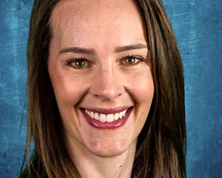 Headshot of a young woman with brown hair