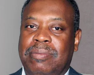 A Black man in a blue suit