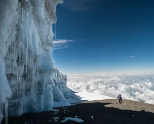 Icy mountain side with hiker