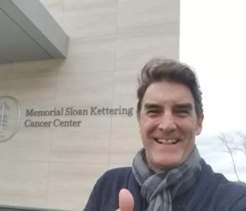 Patrick Boll giving a thumbs up one week after surgery outside of the surgical center