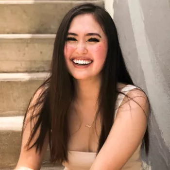 Headshot of Julia VanDuren on staircase