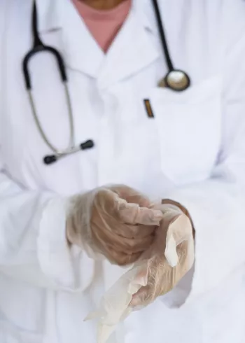 doctor putting on gloves