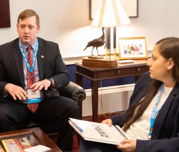 Two advocates sitting in a room at the Capitol 