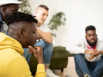 A group of Black men at a support group