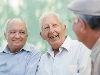 Three senior men talking