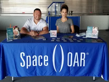 Two SpaceOar representatives tabling at an event