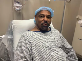 Dennis Stanley in a hospital bed