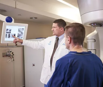 Doctor and patient looking at radiation imaging