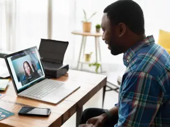 Middle aged man on a video chat with someone