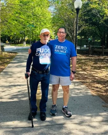Two men pose at the 2023 Atlanta Run/Walk