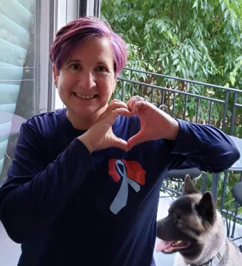 Bogdanos Shirt making a heart with her hands