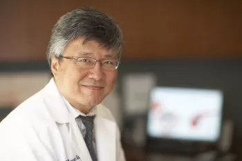 Doctor of Asian descent wearing a lab coat