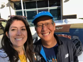 Randy and Vanessa smiling at the camera