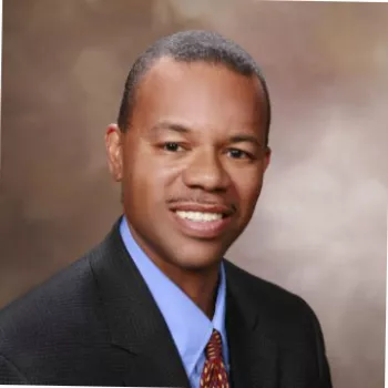 African American man in a dark suit