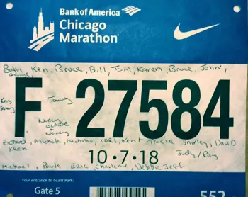 Carl's Marathon bib with signatures on it from 10-7-18