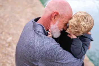 Jeffrey Wilde hugging his grandson