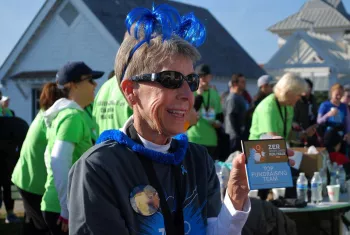 Deb Barr and Larry’s Blue Angels earning the Top Fundraising Award at a ZERO Run/Walk