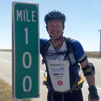 Keith Wegen along the side of the road at Mile 100