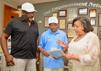 Mellve Shahid, Sr. and two others at The Empowerment Network