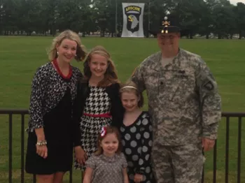 Paul Taylor with his wife and two daughters at a military event