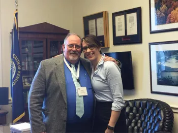 Ray Hensley and his daughter in an office