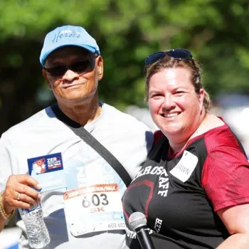 Woman and man in sports gear at an event