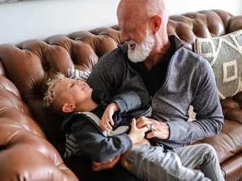 Jeffrey Wilde and grandson on the couch