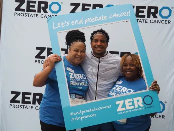Two people posing in ZERO photo frame