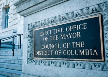 Outdoor sign that says "EXECUTIVE OFFICE OF THE MAYOR COUNCIL OF THE DISTRICT OF COLUMBIA"