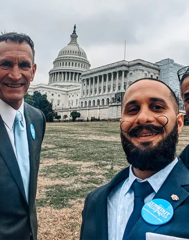 Three ZERO advocates standing on Capitol Hill on a cloud day in 2020