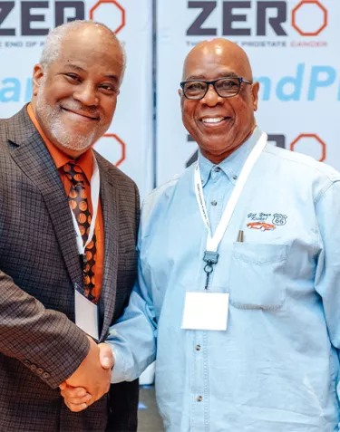 Two men shake hands at ZERO Summit 2020