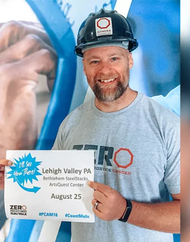 Jamie Bearse wearing a dark firefighter helmet with the ZERO logo