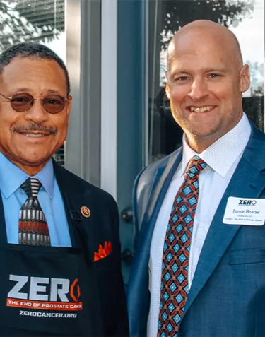 Jamie Bearse and a man wearing a ZERO apron